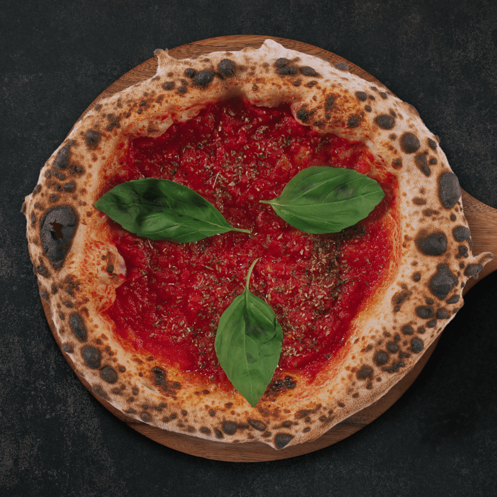Fotografía de una pizza Marinara elaborada en Gussa Pizzería Gandia | Obrador Napolitano | Pizza Napolitana
